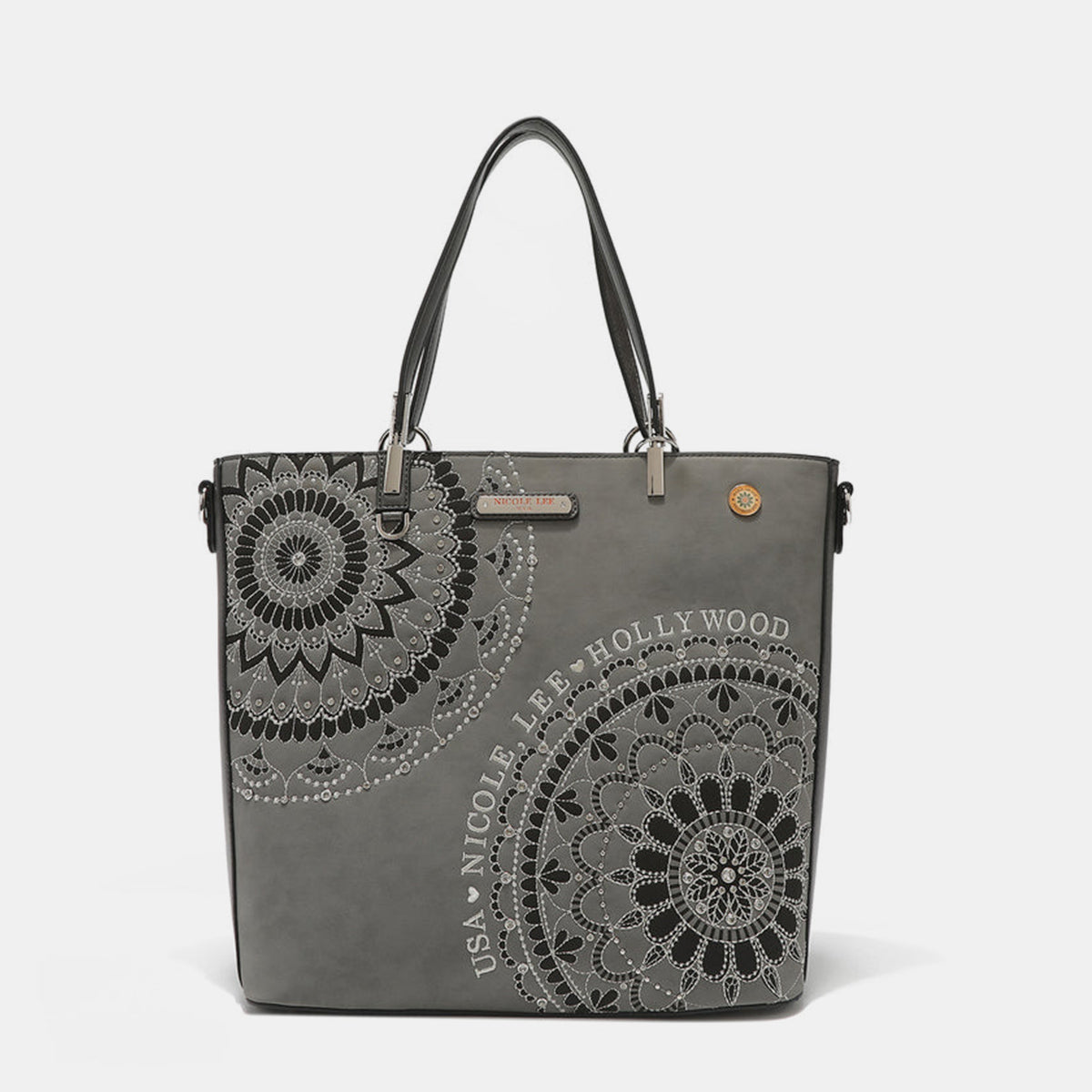 The Nicole Lee USA Metallic Stitching Embroidery Inlaid Rhinestone Tote Bag is a medium shopper in brown, crafted from vegan leather with intricate white mandala patterns and text that reads "USA Nicole Lee Hollywood." It features two shoulder straps, diamond rhinestones, and a decorative emblem on the front.