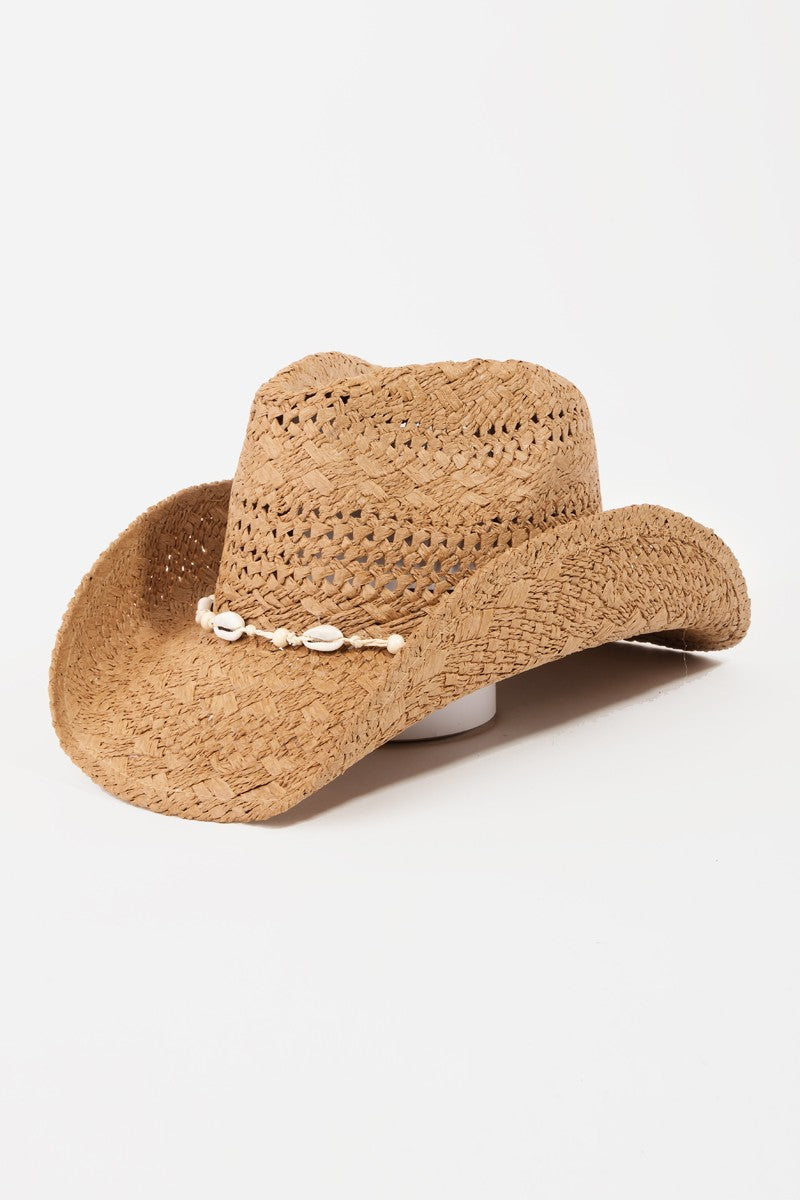 The Fame Openwork Shell Weave Straw Hat is a perfect summer accessory, featuring an intricate openwork design with a decorative band of small white seashells around the base of the crown.