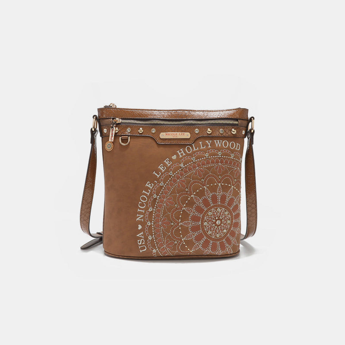 The Nicole Lee USA Metallic Stitching Embroidery Inlaid Rhinestone Crossbody Bag is a brown vegan leather accessory adorned with intricate white designs and text reading "Nicole Lee Hollywood USA" on the front. It features diamond rhinestones, multiple zippered compartments, and an adjustable strap.