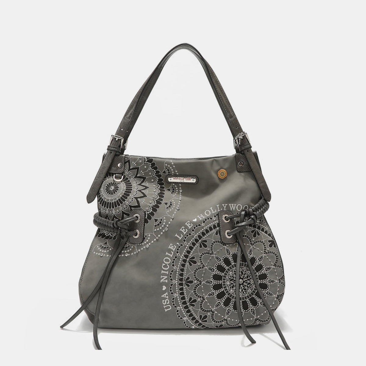 The Nicole Lee USA Side Braided Tassel Inlaid Rhinestone Embroidery Hobo Bag features intricately designed white mandala patterns on brown vegan leather, along with "Nicole Lee Hollywood USA" text. It includes top handles and decorative braided accents, as well as adjustable dual shoulder straps for added versatility.