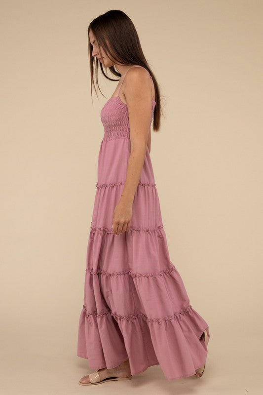 A woman modeling a Woven Smocked Top Tiered Cami Maxi Dress against a neutral background.
