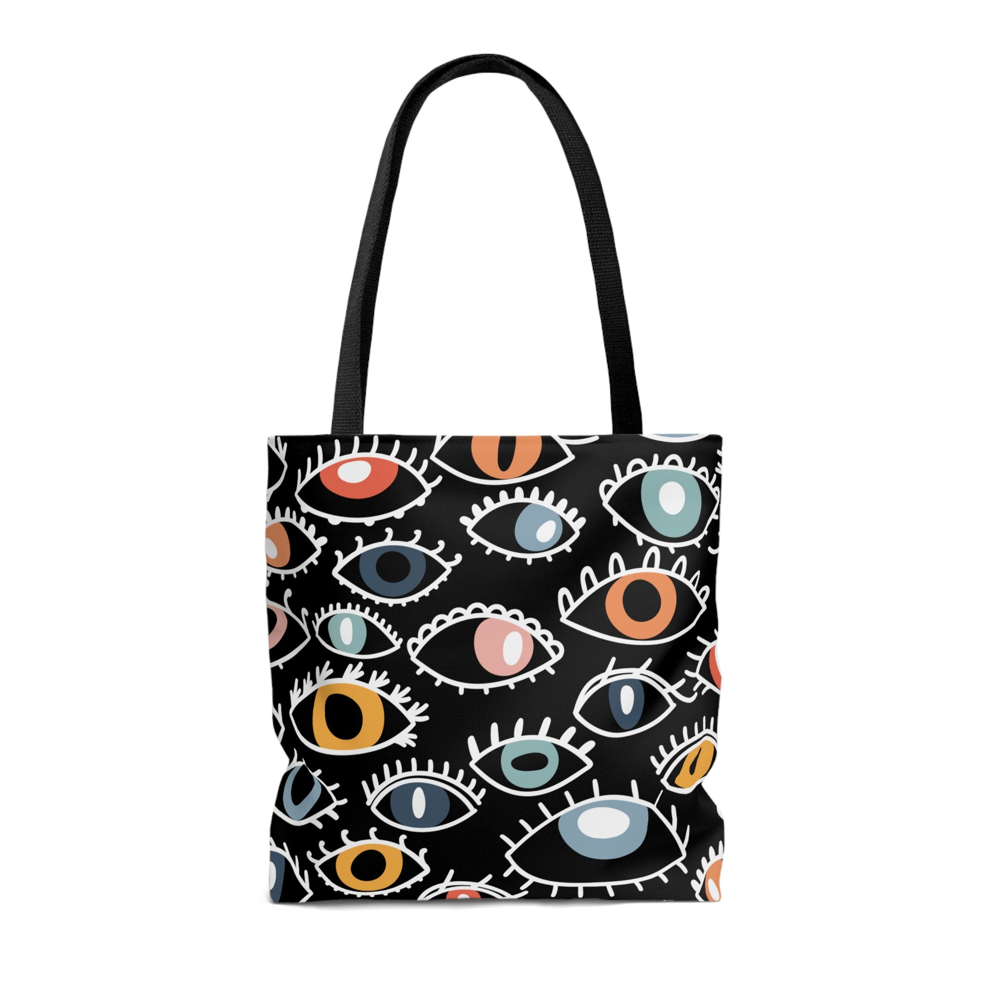 A shopping tote bag featuring a pattern of stylized Egyptian eyes in various colors and designs on a black background, complete with black cotton handles.
