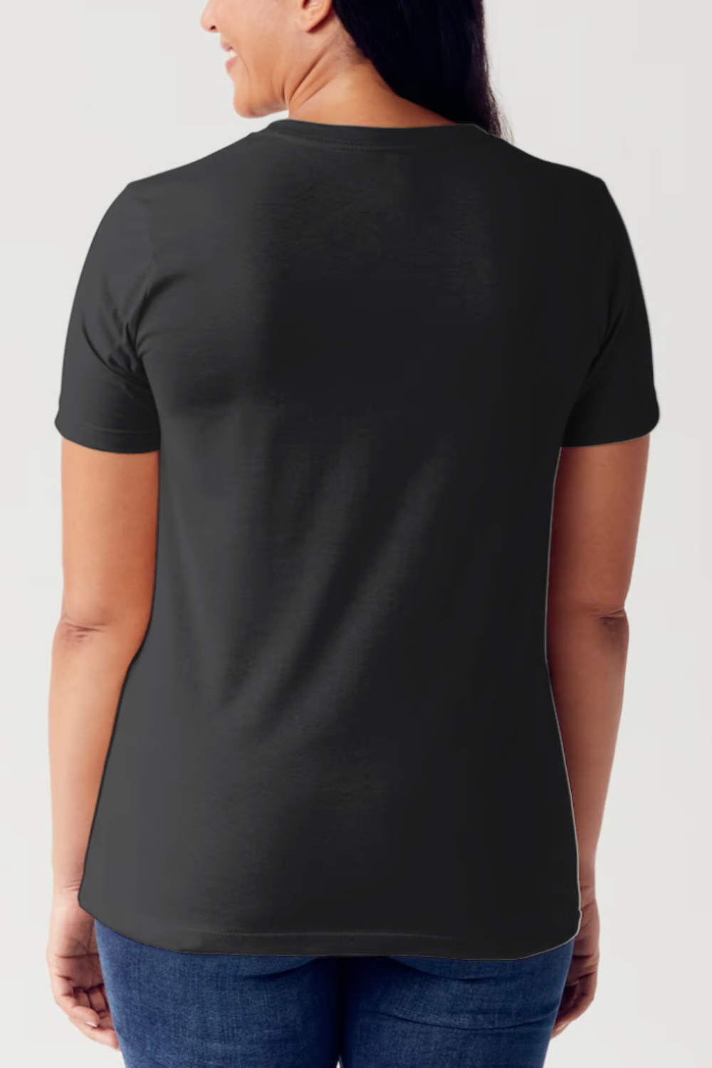 A person wearing a black Simply Love Full Size SPOOKY CLUB Short Sleeve Tubular T-Shirt featuring an illustration of a skeletal hand on the front, made from ringspun combed cotton for ultimate comfort.