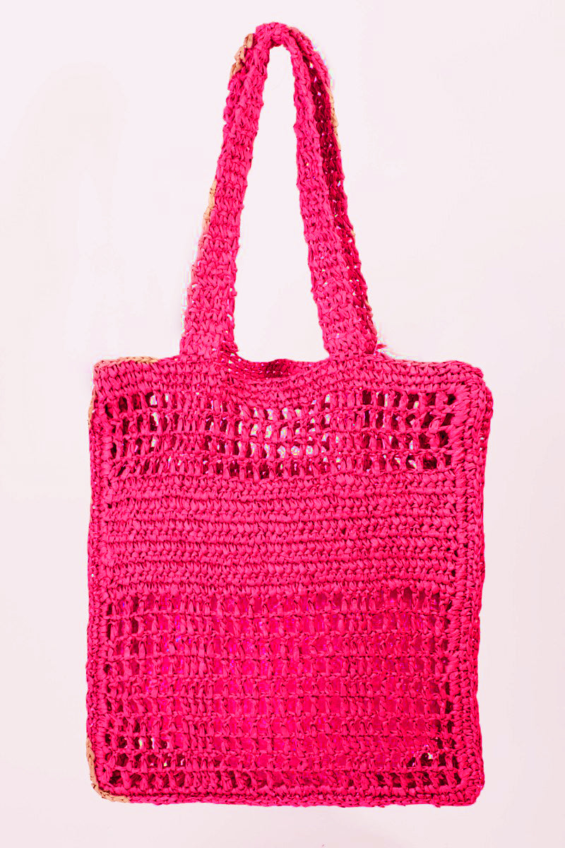 Introducing the Fame Cutout Letter Graphic Handbag, a trendy accessory that showcases a modern design with the word "TROPIC" in bold black lettering on its pink woven surface.