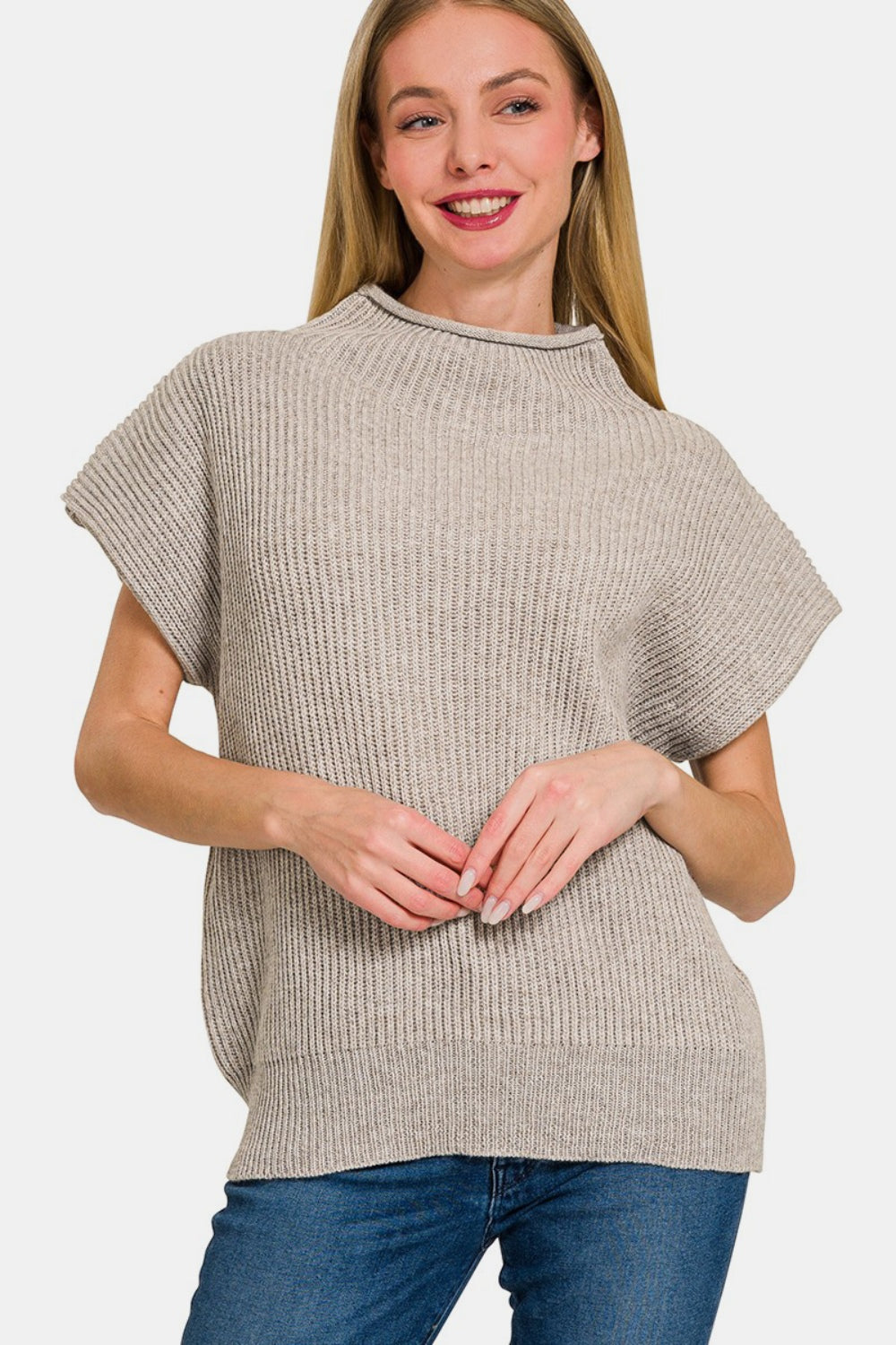 Person wearing a Zenana Short Sleeve Mock Neck Sweater in gray with jeans, standing against a plain background.