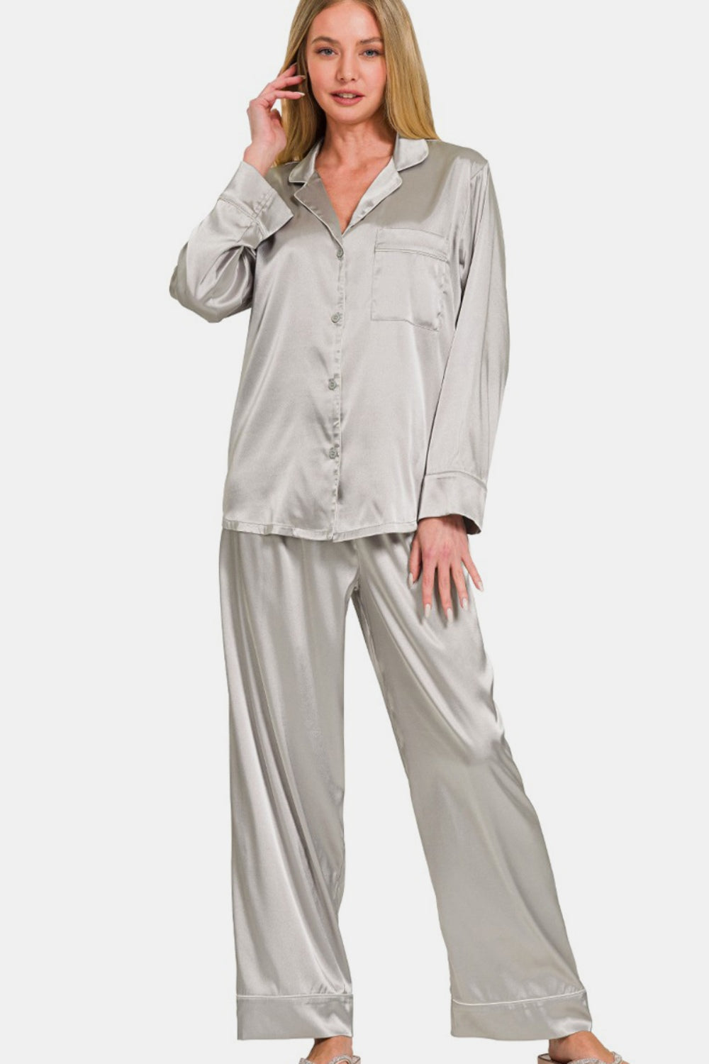 A person wearing the Zenana Satin Long Sleeve Shirt and Pants Pajama Set stands against a plain background.