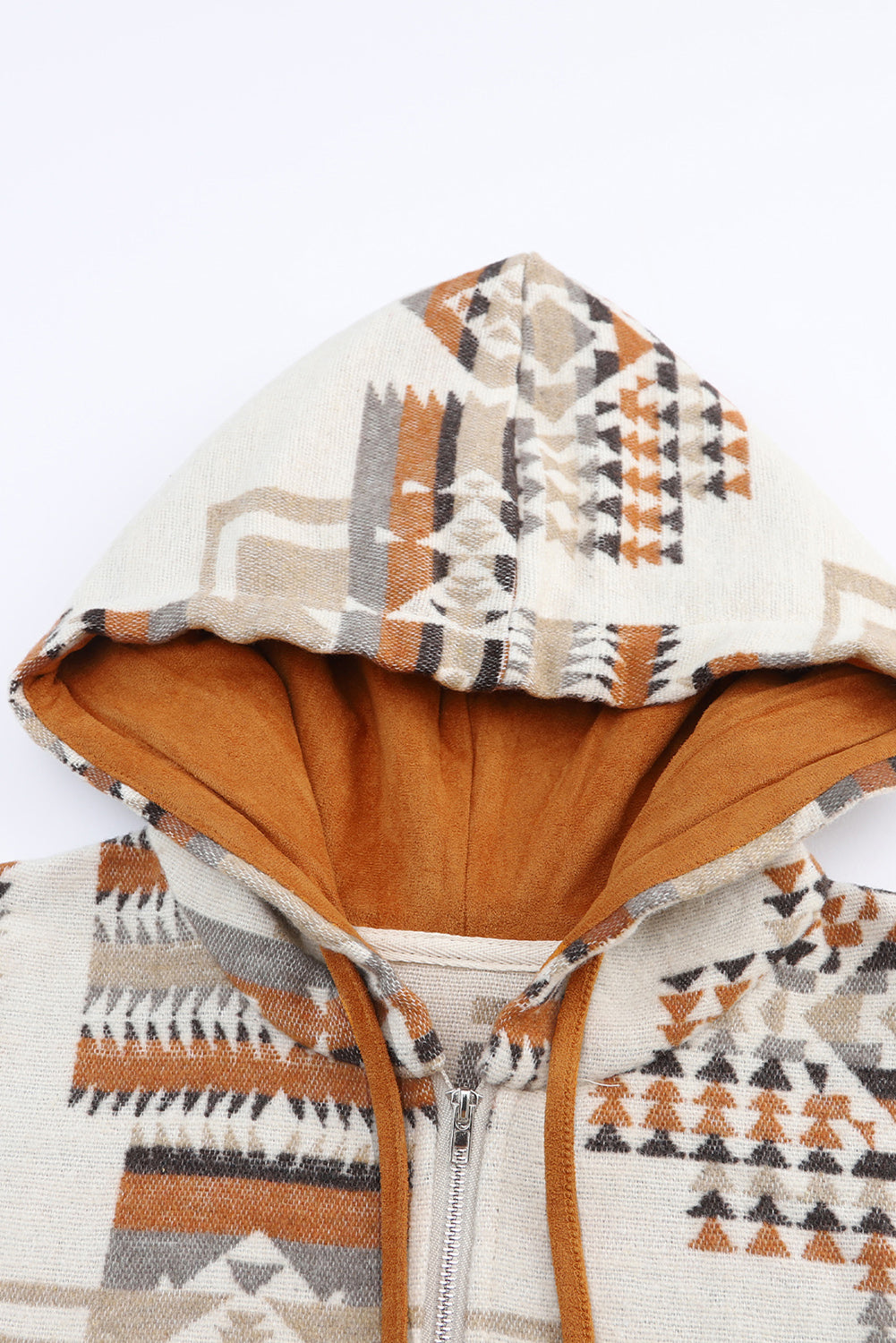 A person with long blonde hair, seen from behind, is wearing the Beige Aztec Print Kangaroo Pocket Half-Zip Hoodie. The hoodie showcases an Aztec pattern in shades of brown, beige, and orange and features a drop shoulder design with a cozy kangaroo pocket, all while standing outdoors.