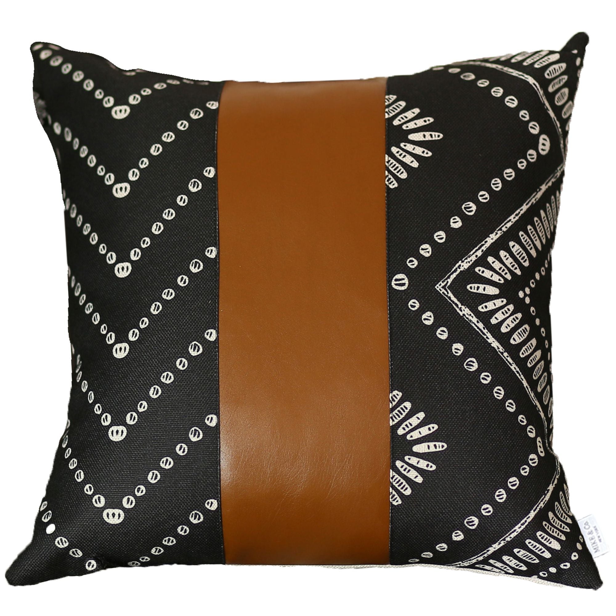 A Bohemian Handmade Decorative Single Throw Pillow featuring a vegan faux leather brown stripe and geometric ivory patterns, set against a beige textured blanket.