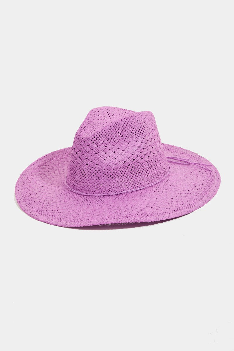 The Fame Straw Braided Sun Hat, with its wide brim and textured purple design, provides outstanding sun protection, making it an ideal summer accessory against a plain white background.