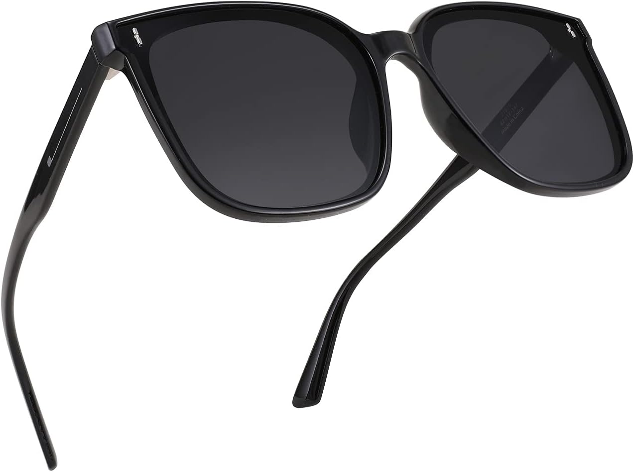 A pair of FEISEDY Women Oversized Vintage Polarized Sunglasses Square Cute Trendy Classic Simple Men B2758 with dark lenses and thin arms.