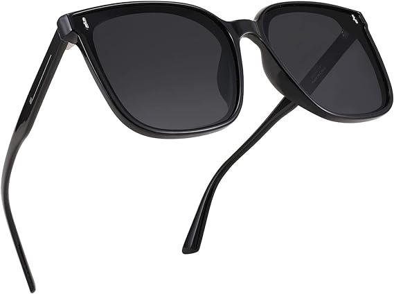 A pair of FEISEDY Women Oversized Vintage Polarized Sunglasses Square Cute Trendy Classic Simple Men B2758 with dark lenses and thin arms.