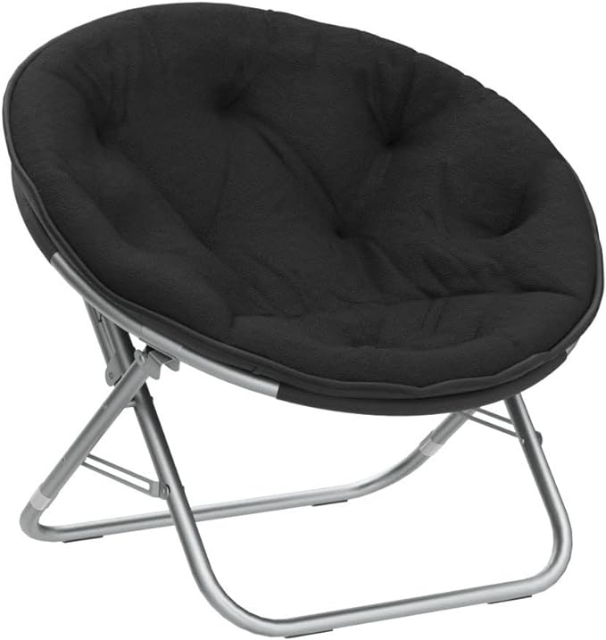 A black, round, collapsible Faux Fur Saucer Chair with a soft cushioned seat and a metallic frame.