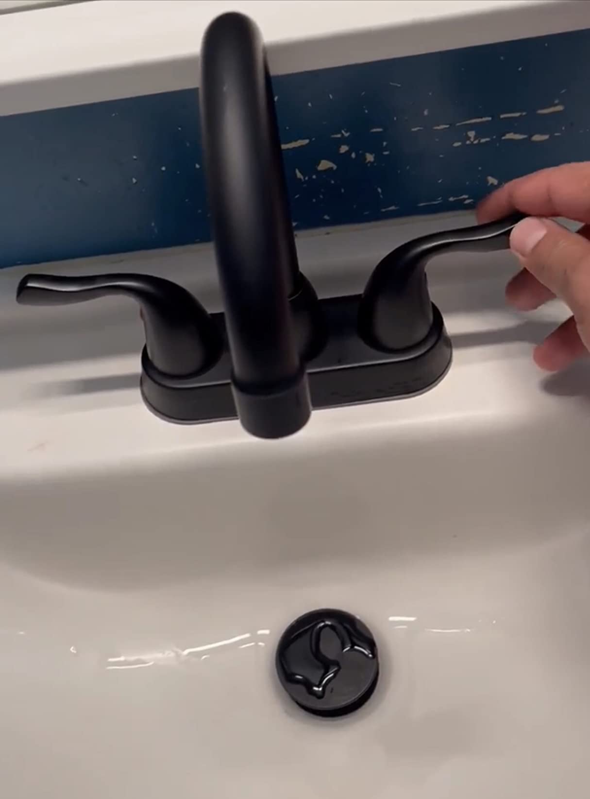 2 Handle Black Bathroom Sink Faucet - 4 Inch Centerset Faucet Bathroom 2 or 3 Hole Lavatory Faucet Bathroom Vanity Sink Faucets with Pop-up Drain and Supply Lines Matte Black installed on a white sink.