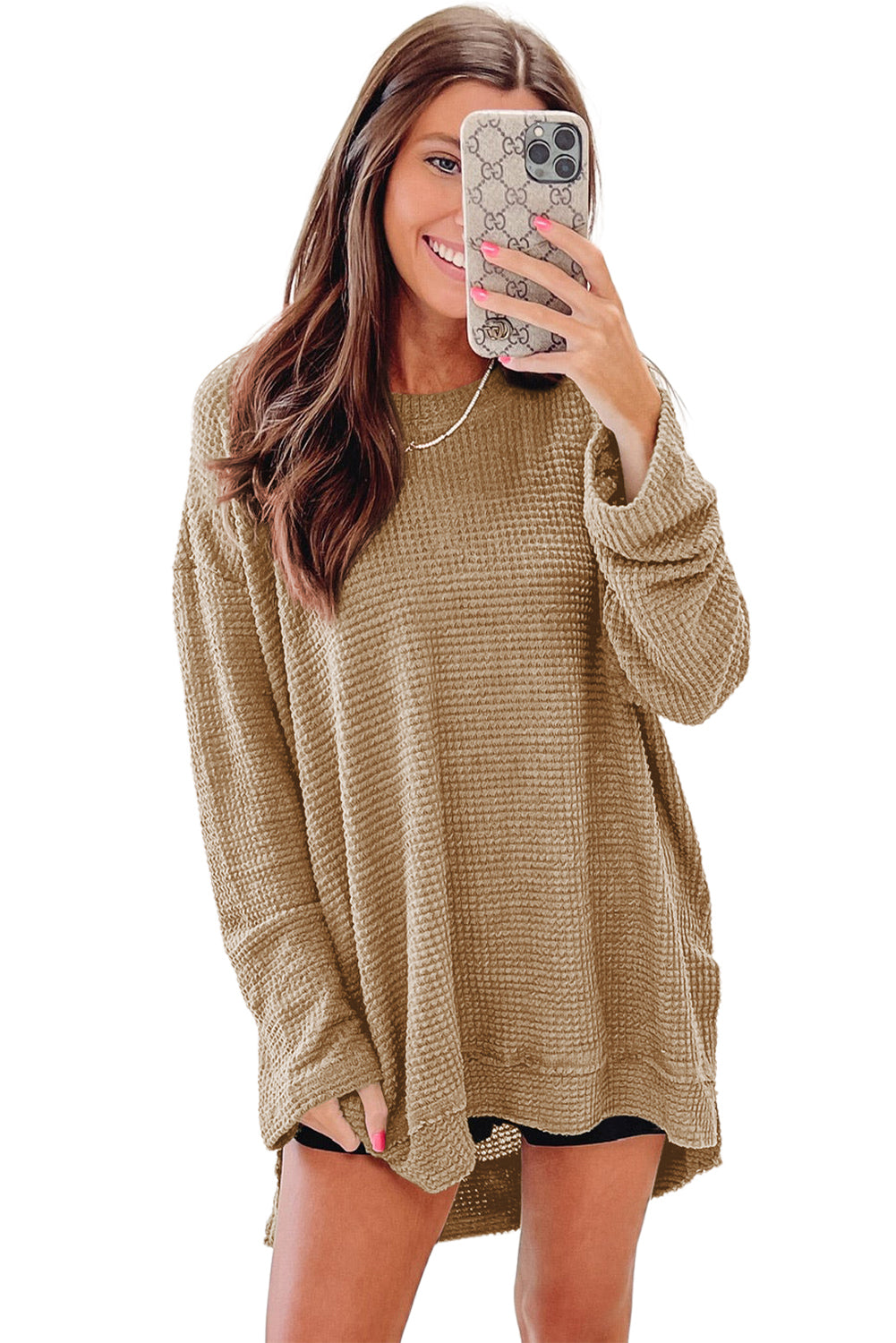 Person wearing a trendy Green Waffle Knit Drop Sleeve High Slits Oversized Top takes a mirror selfie, showcasing the cozy waffle knit texture along with their upper and part of their lower body.