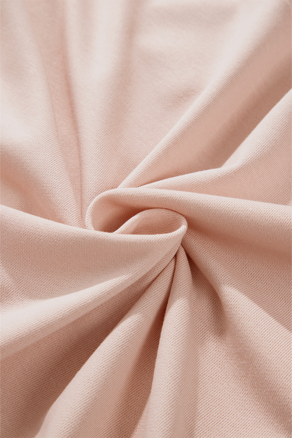 Person wearing the Delicacy Floral Patchwork Star Pattern Drawstring Hoodie, showcasing the floral patchwork design on the hood and sleeves from the back.