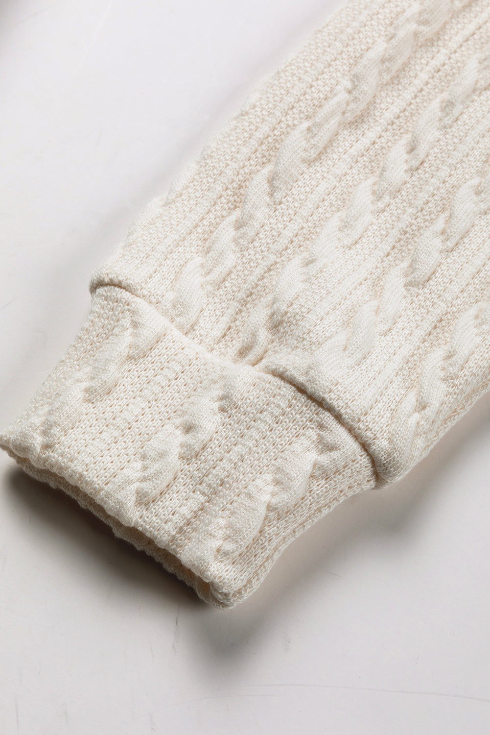 A person wearing a Dark Grey Cable Knit Sleeves Crew Neck Sweatshirt and a gold chain necklace is shown from the shoulders to the waist, standing outdoors.