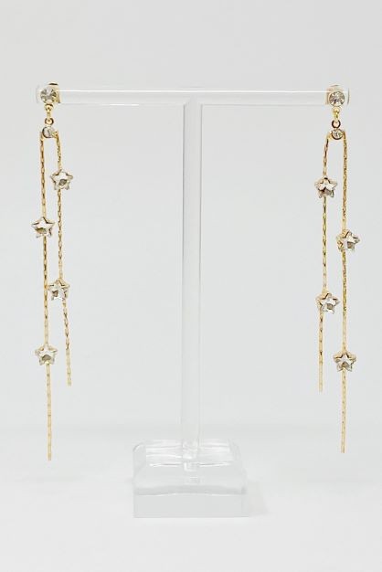 Elegant gold-plated Strands of Stars Earrings on a display stand, perfect for festive parties.