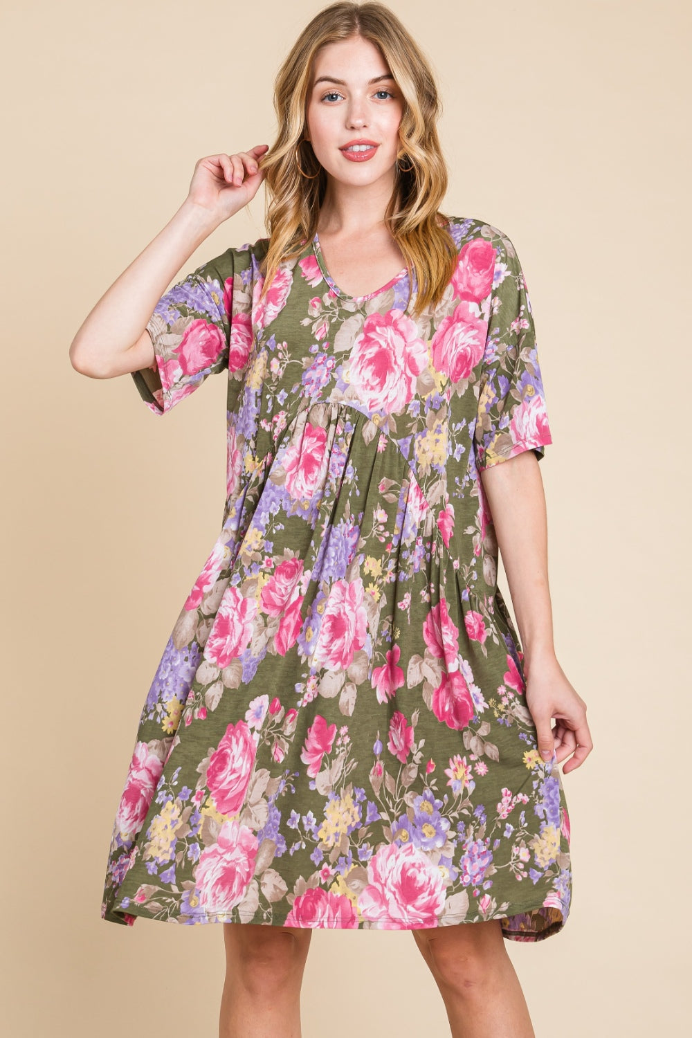 A woman in a BOMBOM Flower Print V-Neck Ruched Dress.