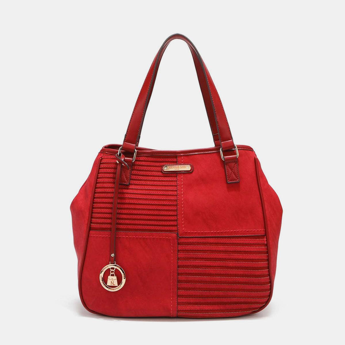 Nicole Lee USA's Scallop Stitched Tote Bag in red is made from vegan leather, showcasing textured stripes and scallop-stitched details, and includes a gold circular charm on one handle.