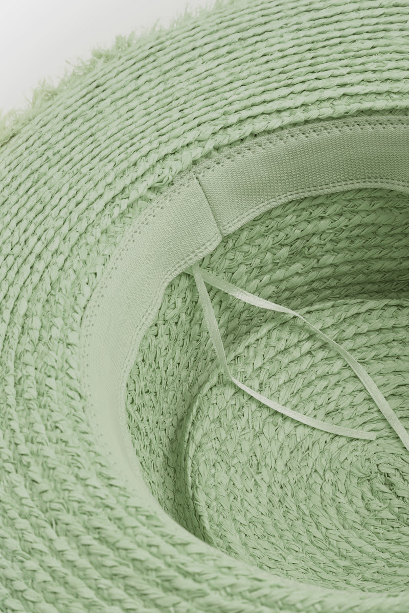 The Fame Braided Strap Wide Brim Hat, featuring a green woven design, provides excellent sun protection.