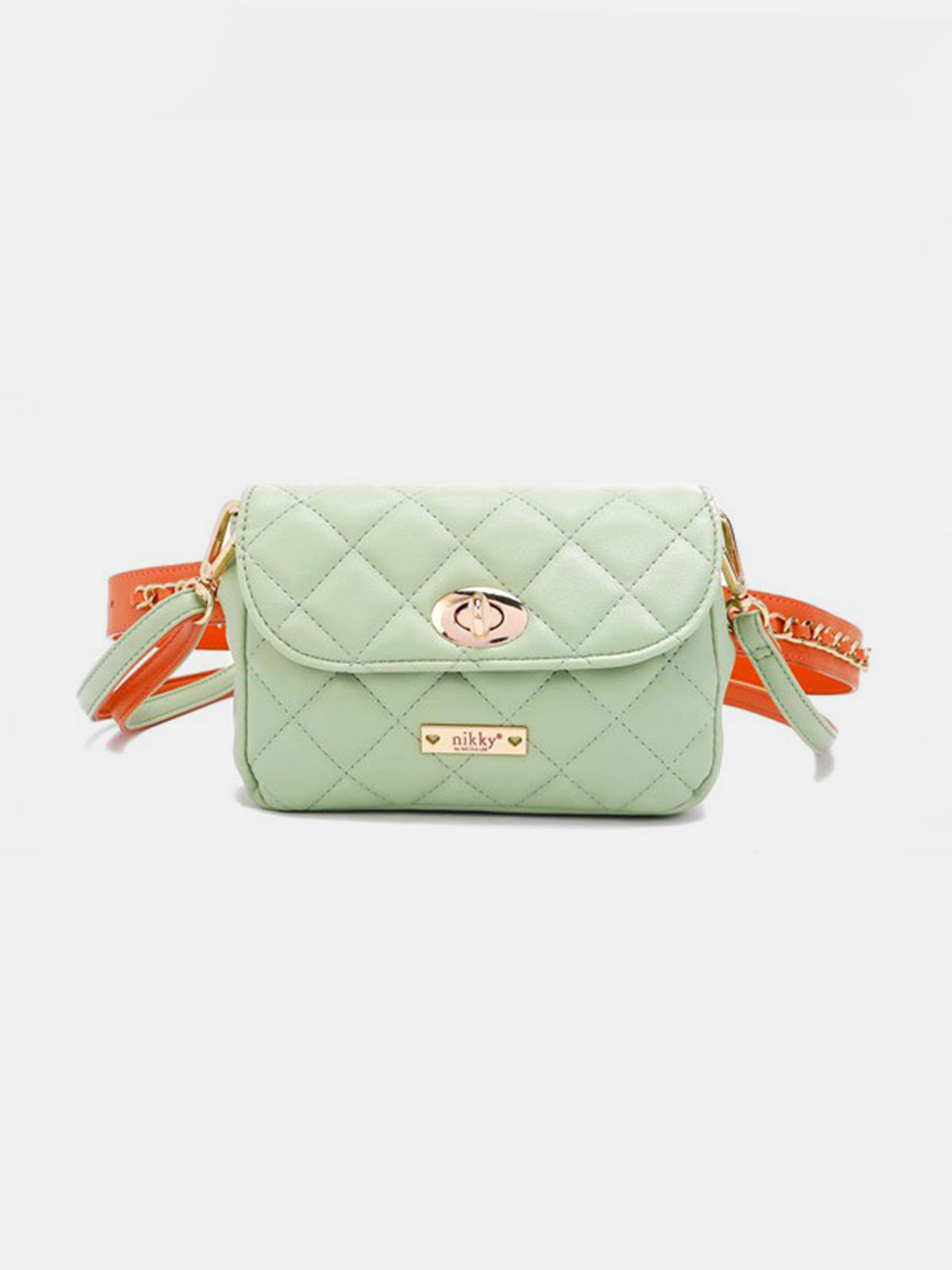 The Nicole Lee USA Quilted Fanny Pack is a light green, quilted crossbody bag crafted from vegan leather. It features gold hardware, including a twist-lock closure and a chain strap interwoven with orange leather accents. The brand name is visible on a gold plate at the front.