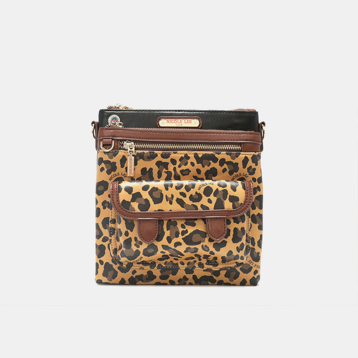 The Nicole Lee USA Leopard crossbody bag is made from vegan leather and showcases a leopard print design. It features a front pocket, a zippered closure, gold-tone hardware, brown trim, and a black panel at the top that is embellished with a brand label.