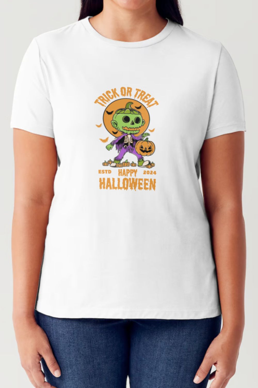 A person wearing a Simply Love Full Size TRICK OR TREAT Round Neck Short Sleeve Tubular T-Shirt in white, featuring a Halloween-themed design with a green skeleton, the text "Trick or Treat", "Happy Halloween 2024", and a pumpkin illustration.