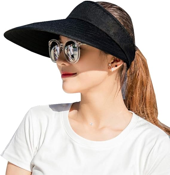 Woman wearing a Sun Visor Hats Women Large Brim Summer UV Protection Beach Cap and sunglasses, styled with a white t-shirt and ponytail, looking to the side against a white background.
