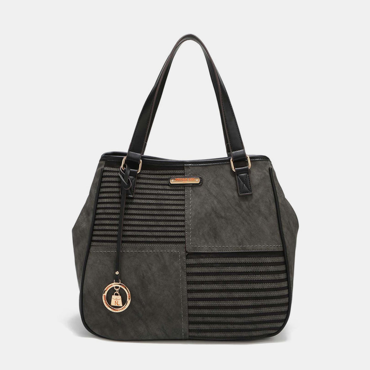 Nicole Lee USA's Scallop Stitched Tote Bag in red is made from vegan leather, showcasing textured stripes and scallop-stitched details, and includes a gold circular charm on one handle.