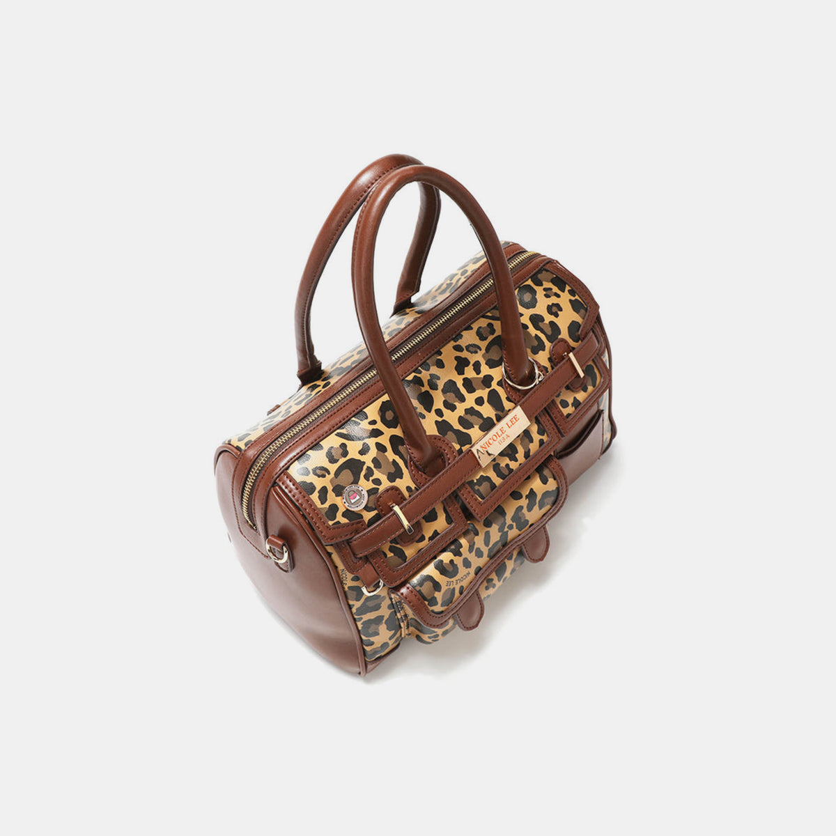 Introducing the Nicole Lee USA Leopard Boston Bag: a stylish vegan leather accessory in chic brown, boasting an eye-catching leopard print design, dual handles, multiple pockets, and adorned with a gold-tone nameplate.