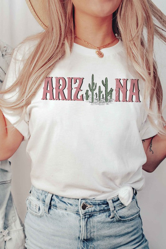 Individual clad in a white ARIZONA CACTUS Graphic Tee, constructed from 100% airlume combed and ringspun cotton, coupled with light blue jeans. Unisex sizing guarantees an ideal fit for everyone.