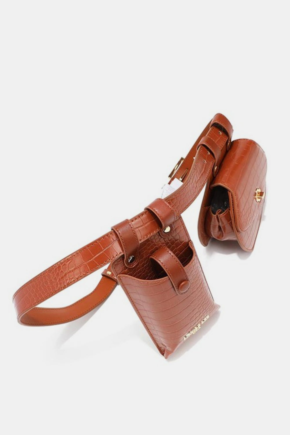 The Nicole Lee USA 2 Piece Texture Belt Bag is a brown vegan leather belt with an attached phone case and small pouch featuring a crocodile skin pattern. The adjustable belt also includes removable pouches for added convenience and style.