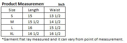 A person dressed in a plaid pleated mini skirt paired with a beige sweater is posed against a plain backdrop. This fashionable and versatile outfit, featuring the Plaid Pleated Mini Skirt, is designed for easy maintenance and can be machine washed in cold water.