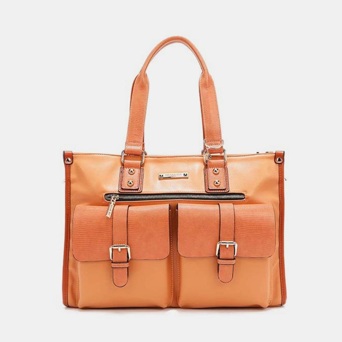 The Nicole Lee USA Large Messenger Bag, made from orange vegan leather, features two front pockets, gold buckles, a top zipper, and dual handles. Set against a white background, this stylish bag provides plenty of storage space for all your essentials.