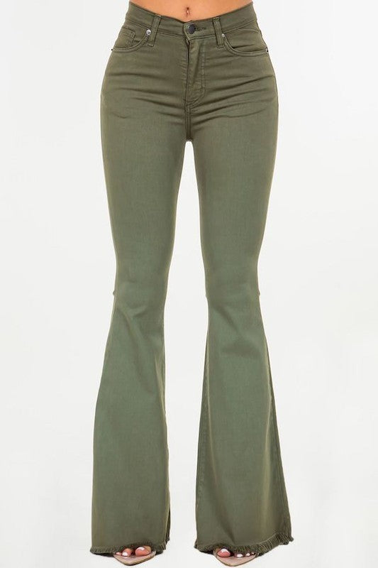 A person wearing the Bell Bottom Jean in Olive, high-rise pants with a 30" inseam, made in the USA, with their torso and feet partially visible against a plain background.