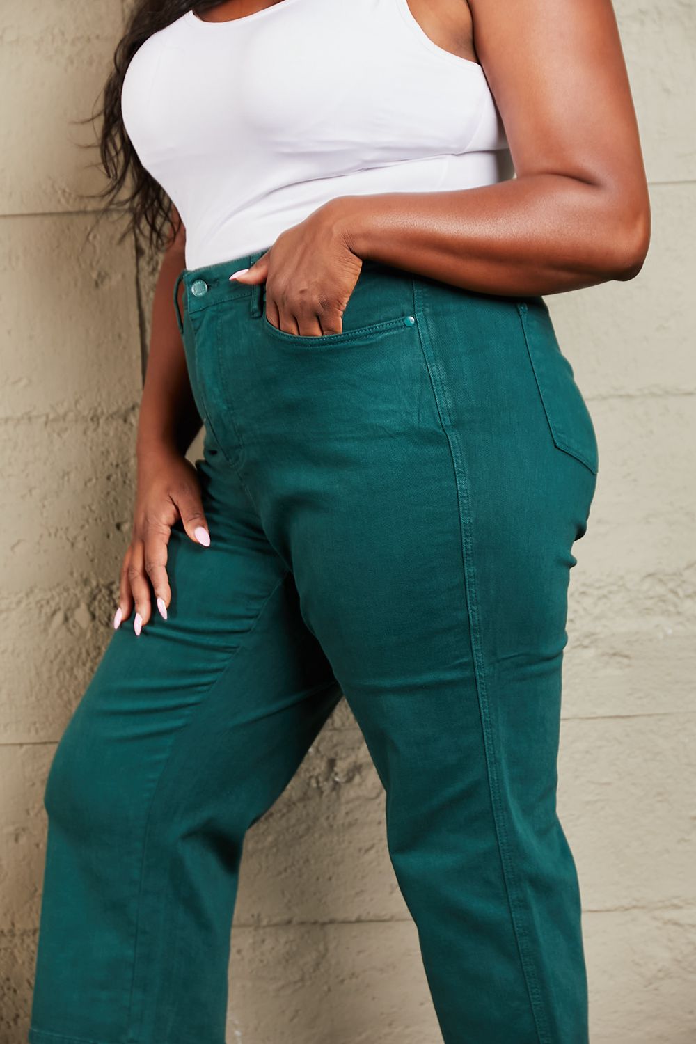 Person wearing Judy Blue Hailey Full Size Tummy Control High Waisted Cropped Wide Leg Jeans that offer subtle silhouette enhancement, paired with stylish white sandals.