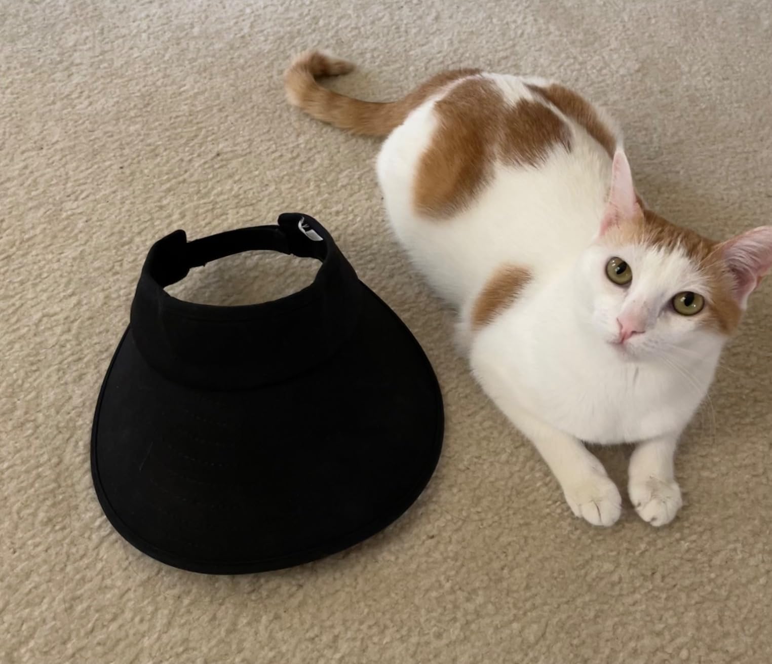 Woman wearing a Sun Visor Hats Women Large Brim Summer UV Protection Beach Cap and sunglasses, styled with a white t-shirt and ponytail, looking to the side against a white background.