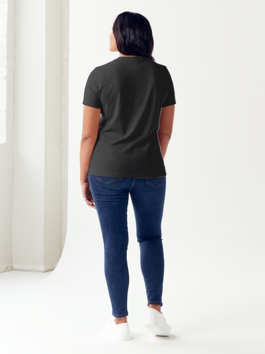 Person standing against a plain background, wearing the Simply Love Full Size VERY CLASSY VERY THOUGHTFUL Letter Graphic Short Sleeve Tubular T-Shirt made from white ringspun combed cotton.