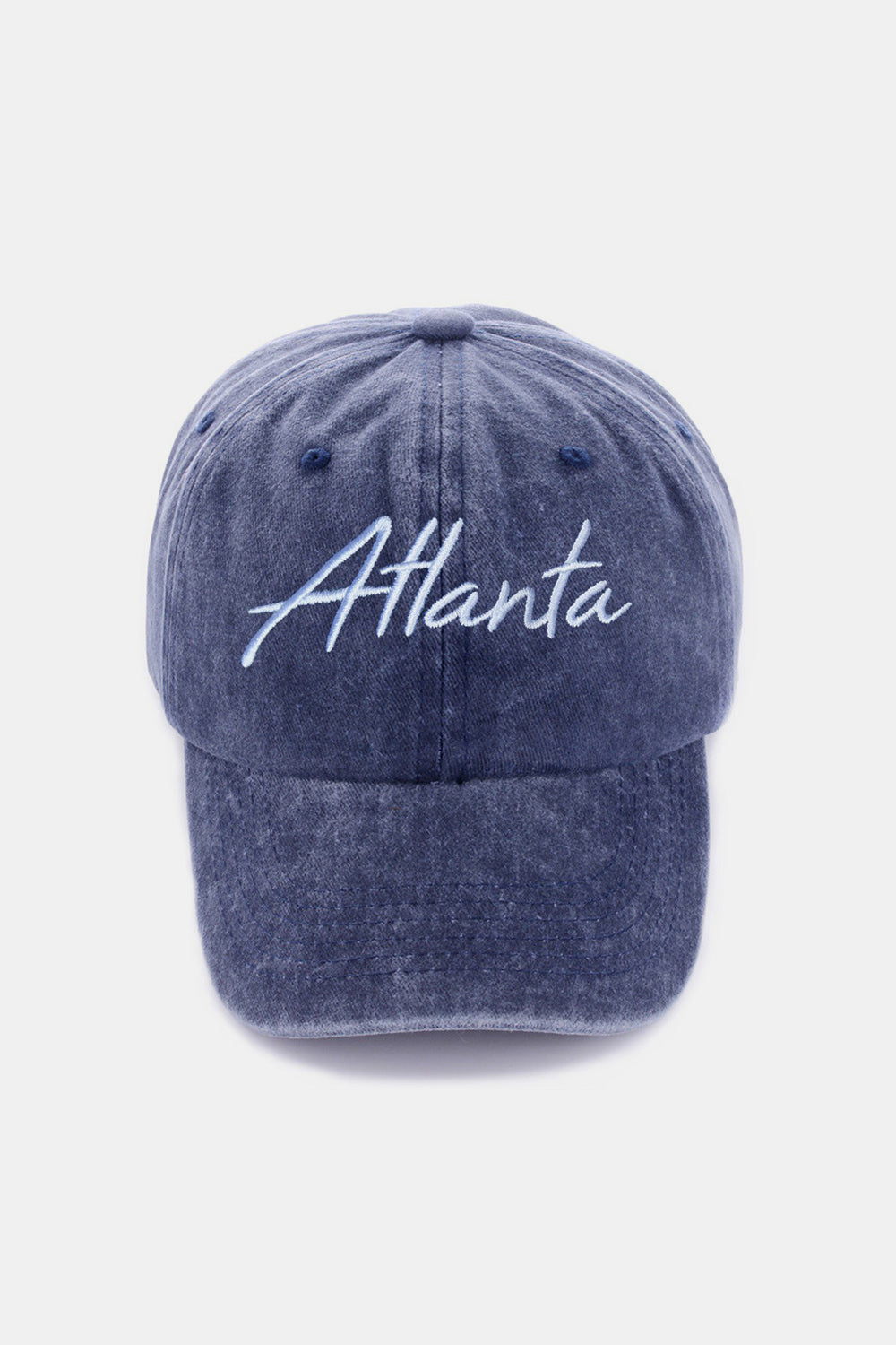 The Zenana Washed ATLANTA Embroidered Baseball Cap is a vintage style accessory, showcasing the word "Atlanta" embroidered in white on its blue denim front.