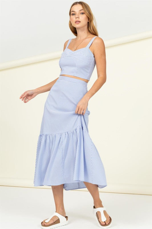 Person wearing a Sweetheart Neck Wide Strap Cami Crop Top in blue and white stripes, complemented by matching bottoms, posing against a neutral background.