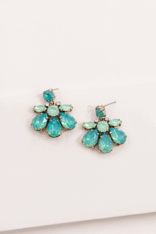 A pair of Water Lily Stone Earrings with iridescent green stones against a white background.