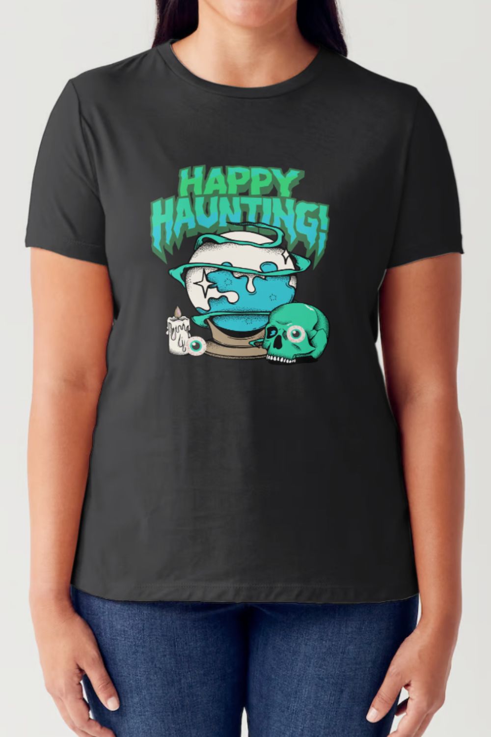 A person is wearing the Simply Love Full Size HAPPY HAUNTING Short Sleeve Tubular T-Shirt, made of breathable fabric and adorned with a "Happy Haunting" graphic featuring a spooky fishbowl, a skull, and a haunted house illustration.