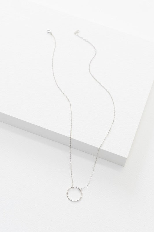 Maddox Circle Charm Necklace 14K on a delicate chain against a white background.