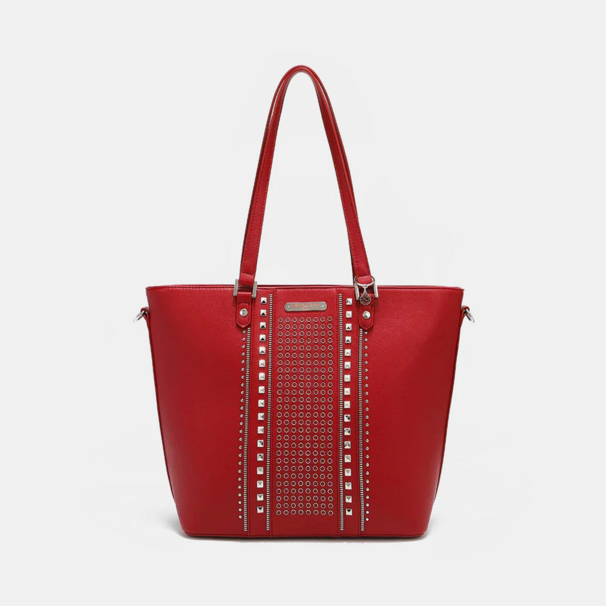 The Nicole Lee USA Studded Decor Tote Bag boasts a trendy appeal with its vegan leather material, highlighted by silver studs and dual shoulder straps, showcased against a white background.