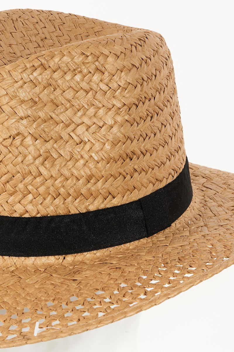 The Fame Basket Weave Straw Sun Hat, featuring a black band and ideal as a fashion accessory, is showcased on a clear stand against a white background.