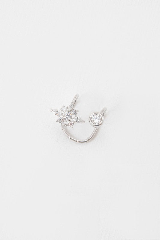 An open First Star Ear Cuff with a star-shaped cluster and a single round gemstone on a white background.