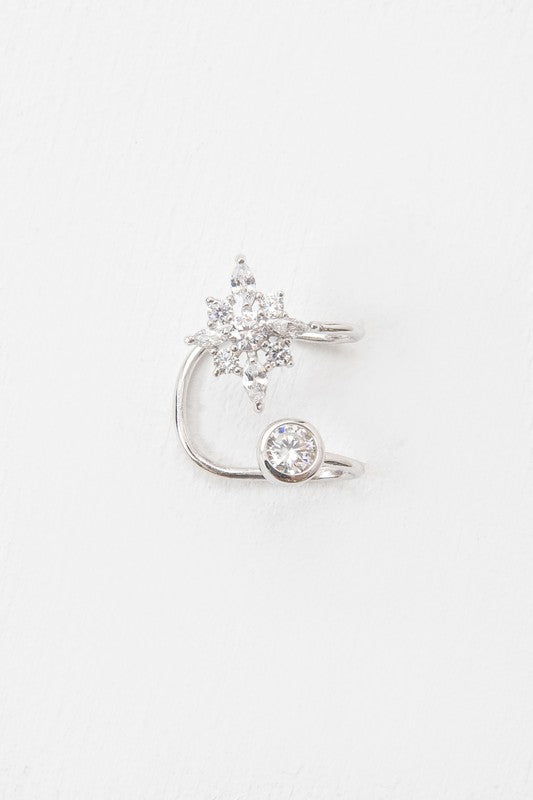 An open First Star Ear Cuff with a star-shaped cluster and a single round gemstone on a white background.