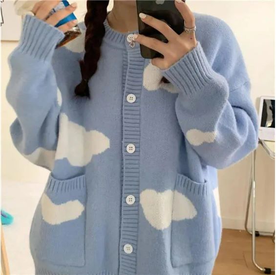 A person in a Kawaii Knitted Clouds Sweatshirt takes a selfie, obscuring their face with a smartphone, featuring Asian size.