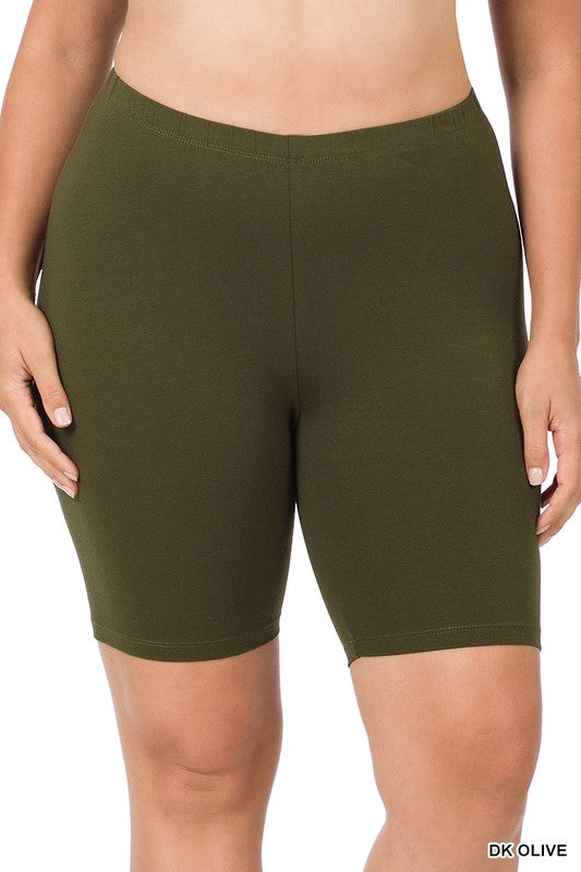 Close-up of a person wearing Plus Premium Cotton Biker Shorts made from stretchy fabric. The person's hands rest at their sides, highlighting the comfort and flexibility of this activewear.