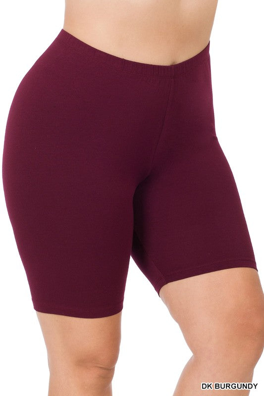 Close-up of a person wearing Plus Premium Cotton Biker Shorts made from stretchy fabric. The person's hands rest at their sides, highlighting the comfort and flexibility of this activewear.